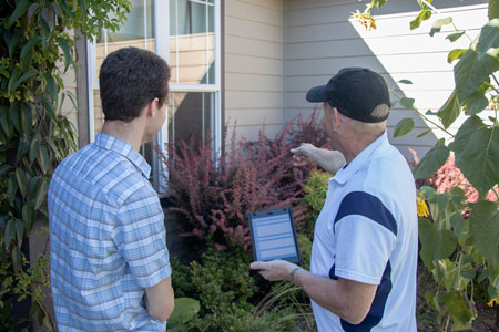 Exterior Home inspection with client